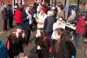 Observing the partial solar eclipse in Tiverton Pannier Market